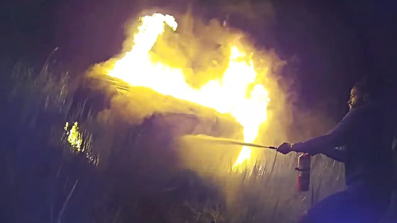 Image for New York police officer and Good Samaritans save 68-year-old woman from vehicle engulfed in flames